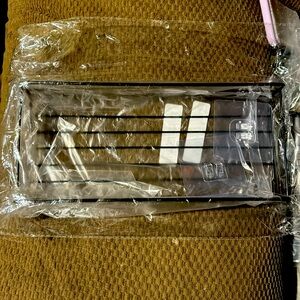 Black stainless steel. Adhesive shower caddy.